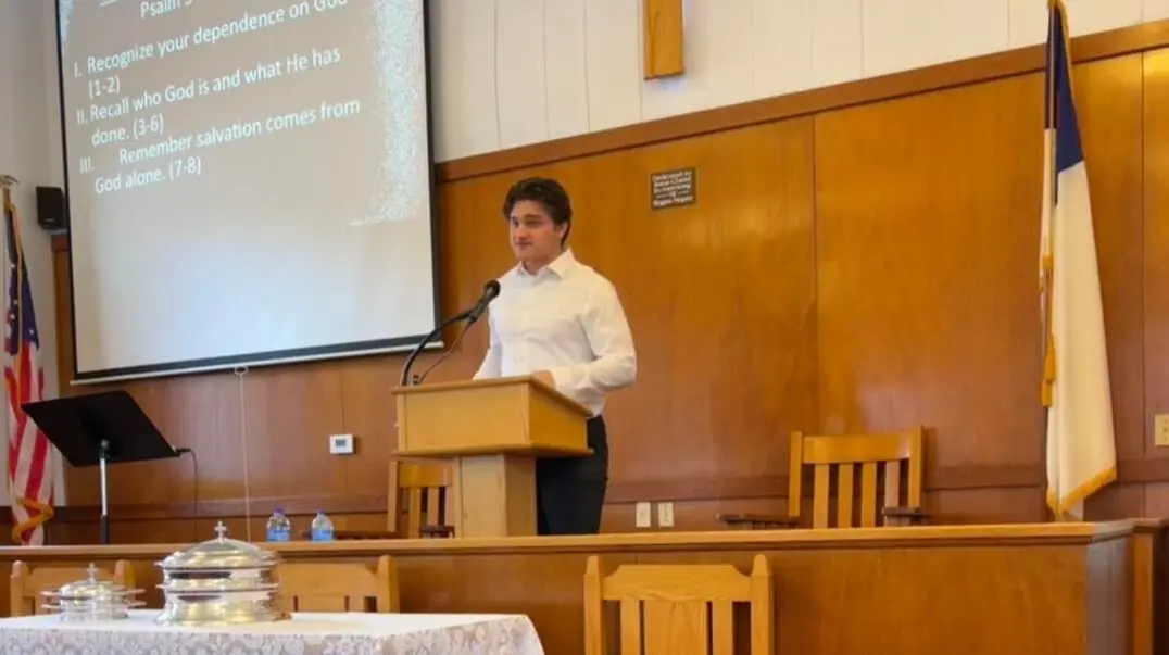 An HBC intern preaching from the pulpit